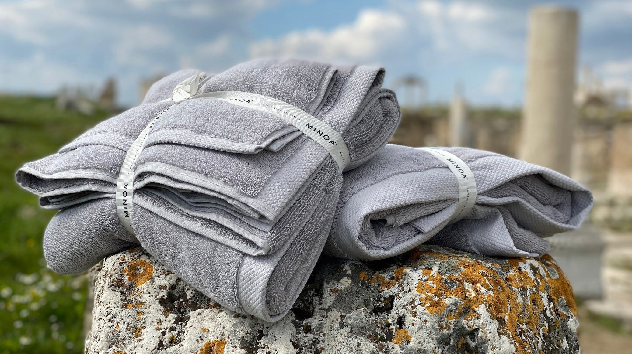 Two pieces of Minoa towel sitting on the rock