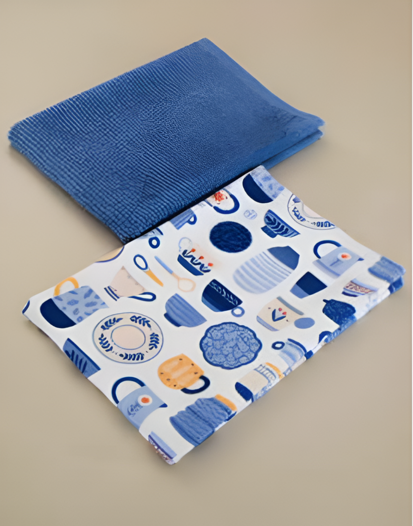 Blue textured kitchen towel and patterned blue and white fabric on a beige background