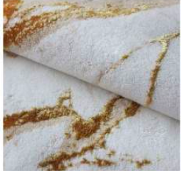 Luxurious ecru and beige bath rug with rich gold accents, adding a touch of opulence and elegance to your bathroom