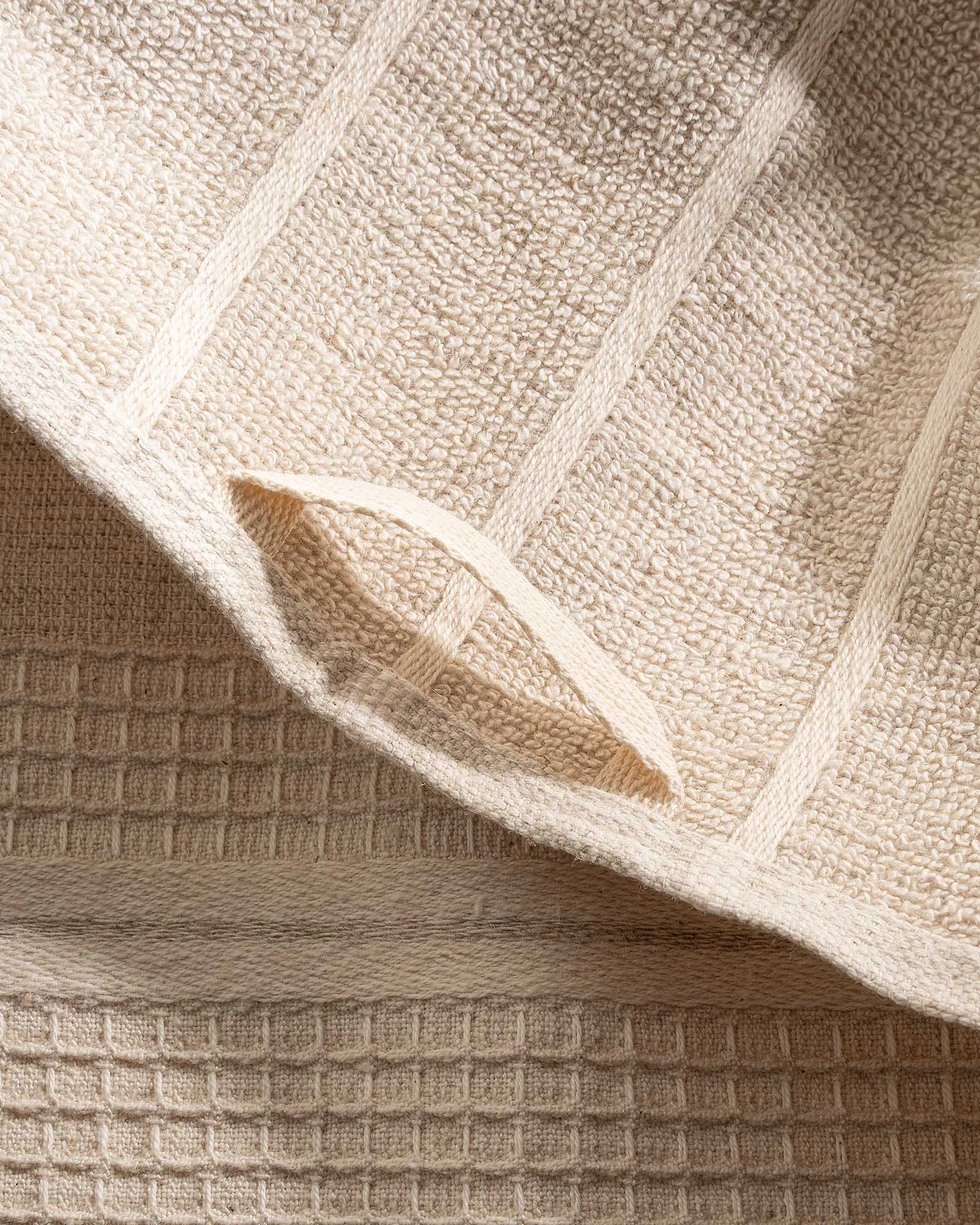 Close-up of beige textured towel with a diamond pattern