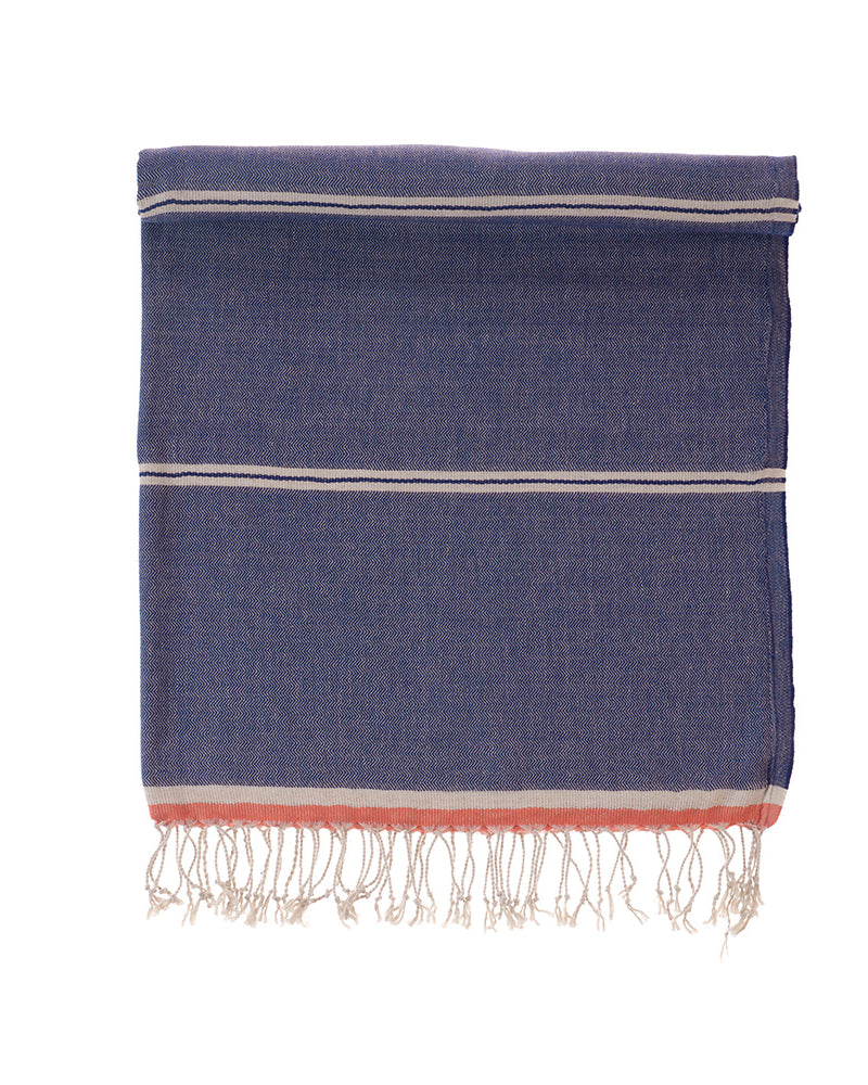 Blue towel with white and red stripes on a white background
