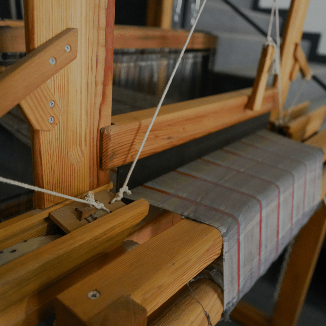 Minoa's woven machine by the staircase