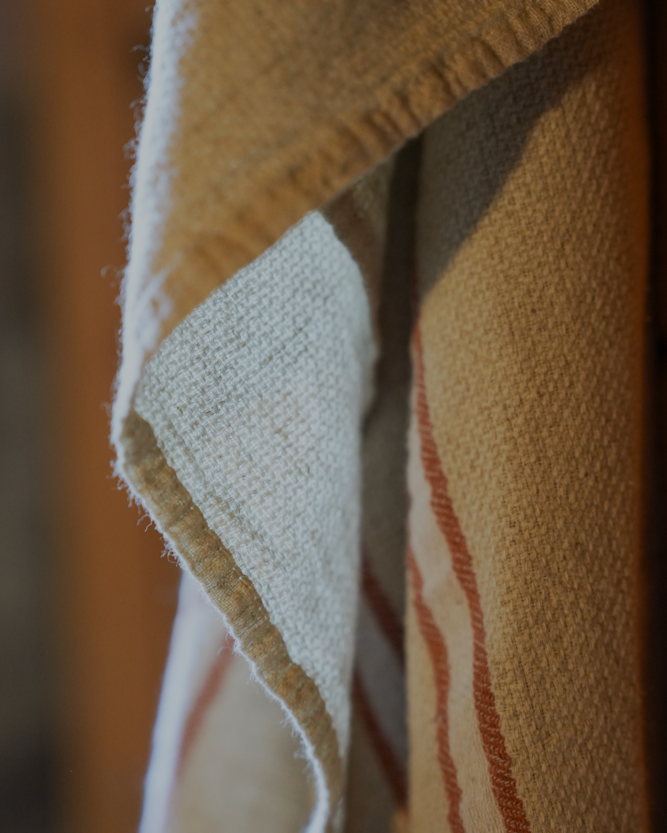 Luxuriously soft natural Anakao 215 gram Aegean Cotton and Linen Turkish towel hanging on the wall showcasing luxury bath towel quality