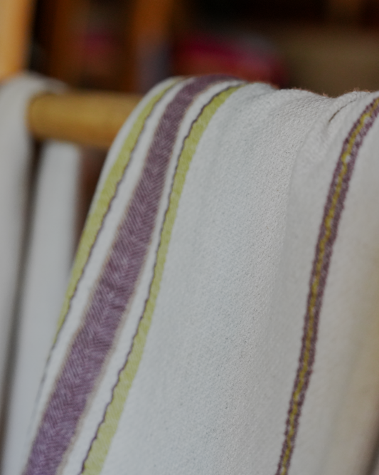 Two organic luxury bath towels from the Elba Turkish collection hanging on the same cloth hanger