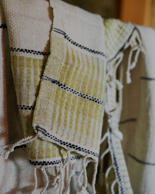 A close up shot of green version Palawan 220-gram Linen Hand Towel showcasing fabulous, luxuriously soft texture