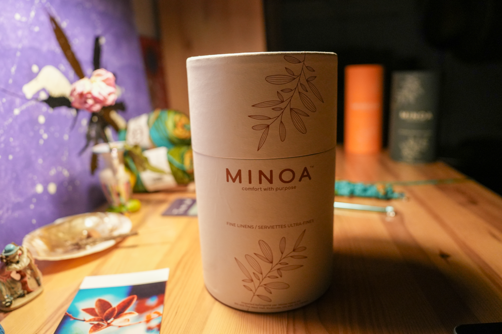 Close-up of Plush Lite 500-Gram Aegean Cotton luxury bath towels guest bath and hand towel set in a luxurious white cylinder case