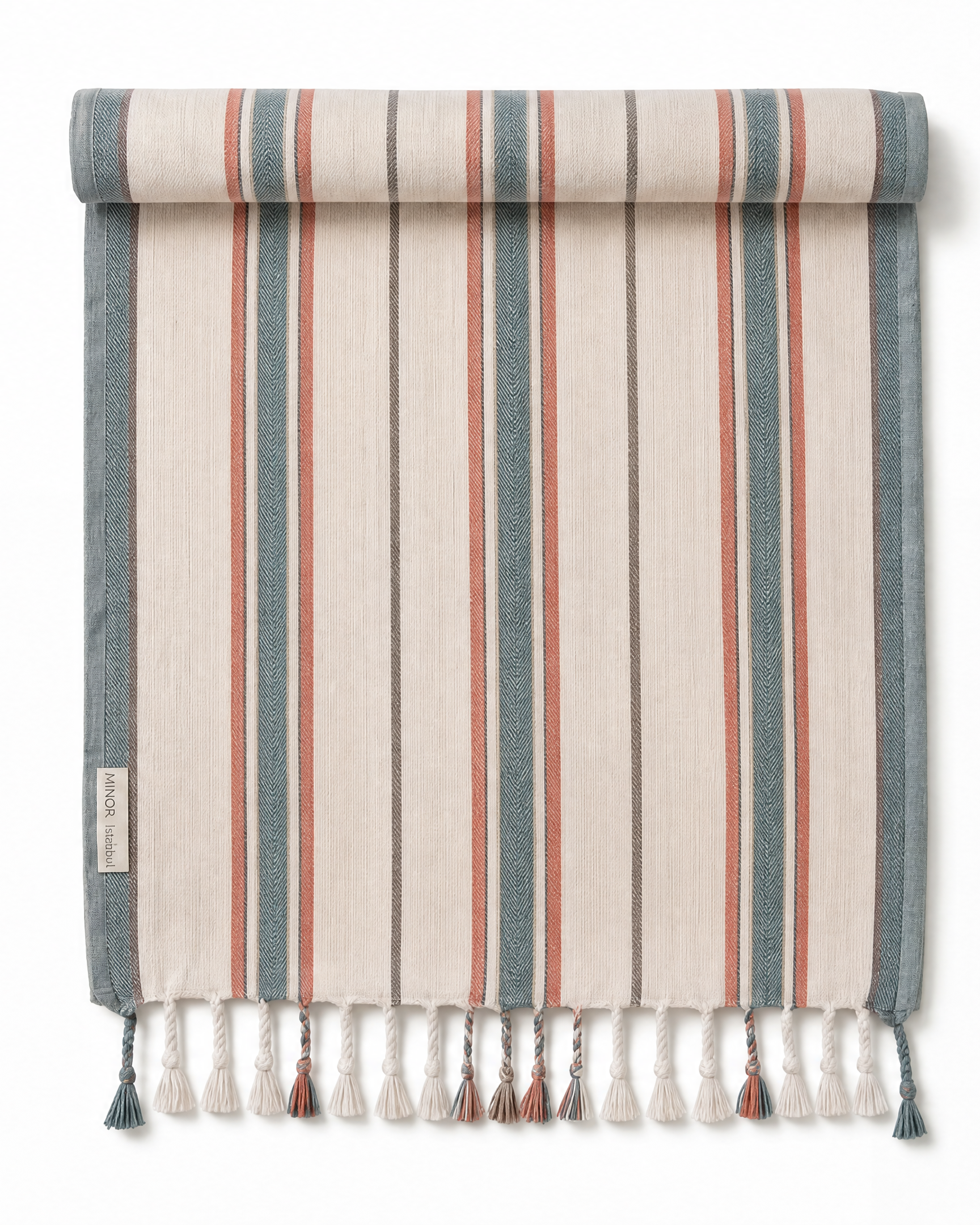 A striped woven towel shown rolled at the top and hanging flat with tassels at the bottom. The design features vertical stripes in beige, slate blue, and terracotta red on a white background.