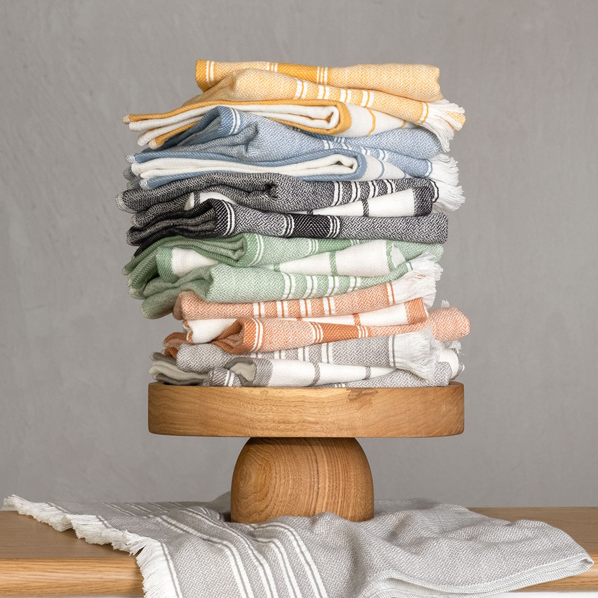 Elis Organic Aegean Cotton Kitchen Towel set of 3, featuring Lime Breeze, Silver Symphony, Midnight Velvet, Spice Serenade, Lemon Zest, and Serene Sky, neatly folded.