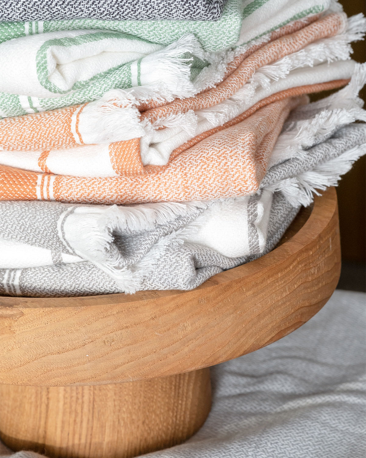 Close-up of the Elis Organic Aegean Cotton Kitchen Towel set of 3, featuring Lime Breeze, Silver Symphony, Midnight Velvet, Spice Serenade, Lemon Zest, and Serene Sky, neatly folded.