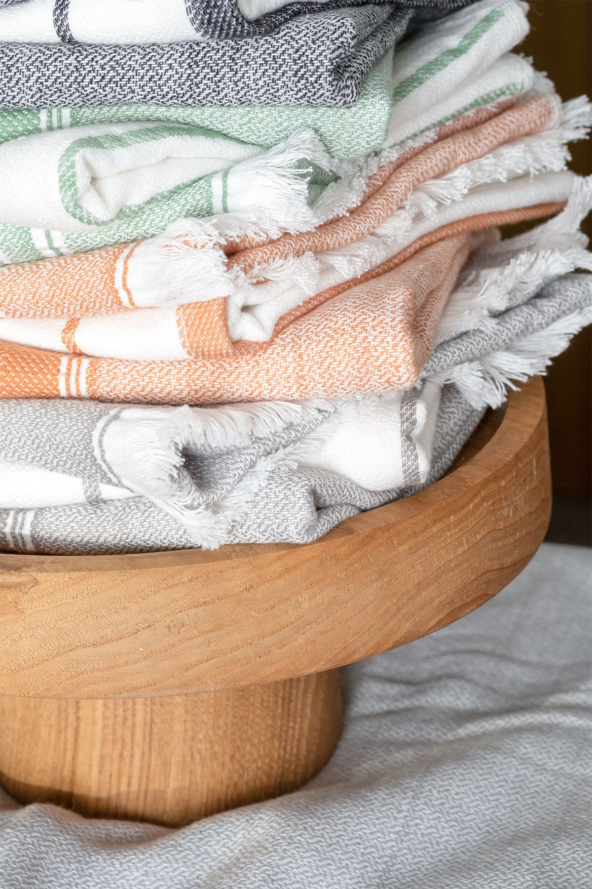 Close-up of the Elis Organic Aegean Cotton Kitchen Towel set of 3, featuring Lime Breeze, Silver Symphony, Midnight Velvet, Spice Serenade, Lemon Zest, and Serene Sky, neatly folded.
