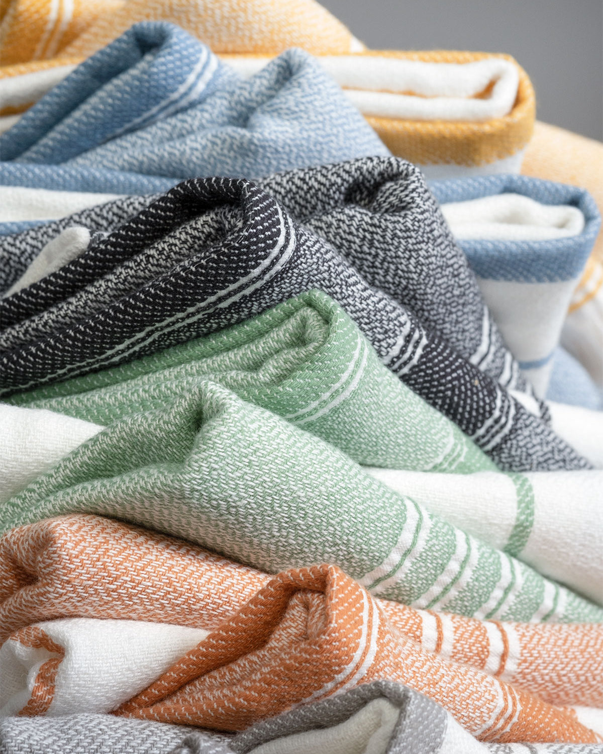 Elis Organic Aegean Cotton Kitchen Towel set of 3, featuring Lime Breeze, Silver Symphony, Midnight Velvet, Spice Serenade, Lemon Zest, and Serene Sky, neatly folded