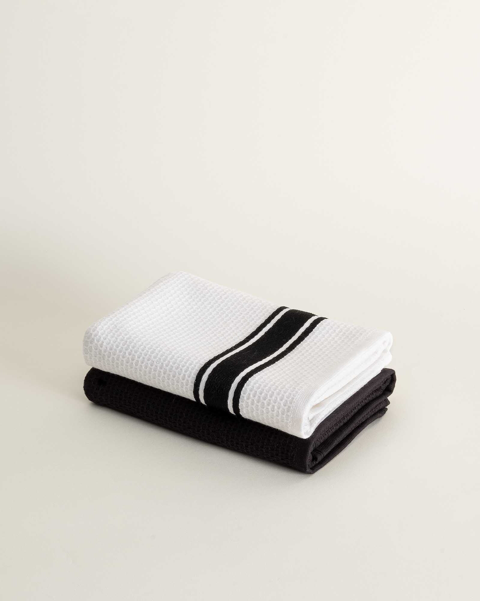 Elvin Organic Aegean Cotton Kitchen Towel set of 2 in Onyx Obsession, neatly folded, highlighting its deep, sophisticated colour and soft texture