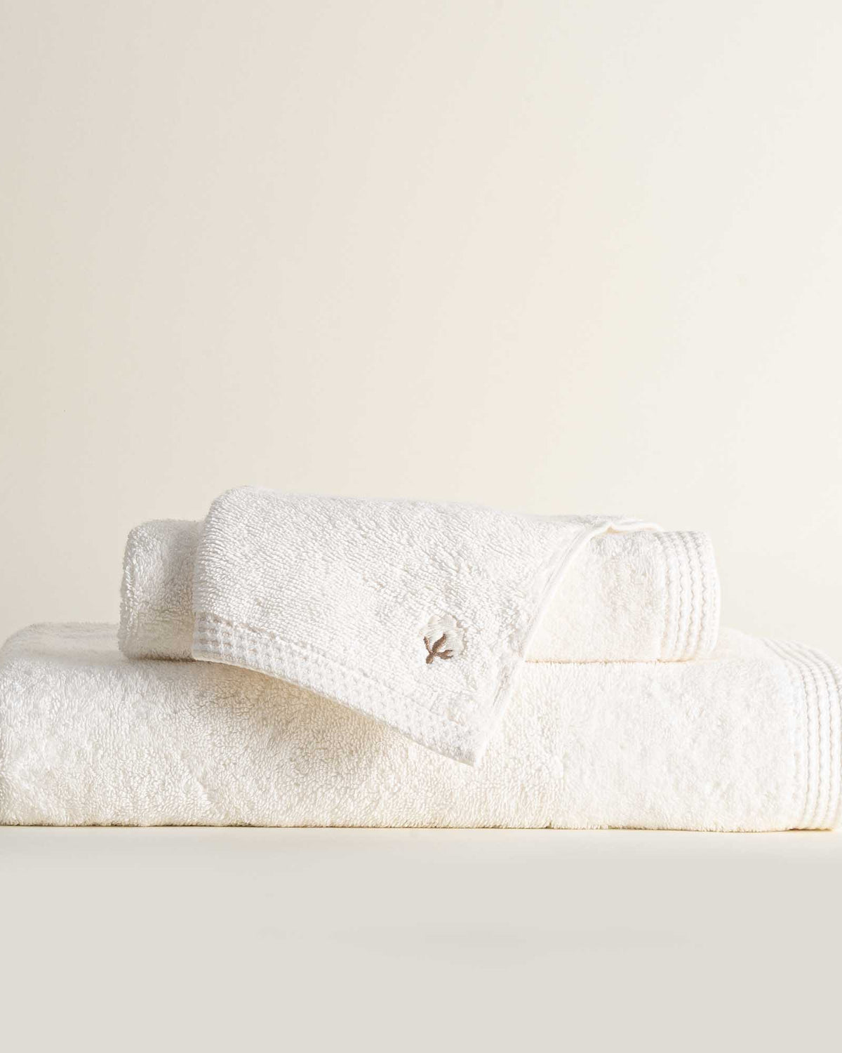 Jasper 600-gram organic Aegean cotton luxury bath, hand, and washcloth towels in Ivory Embrace, showcasing soft plush texture, light tone, and luxurious fabric