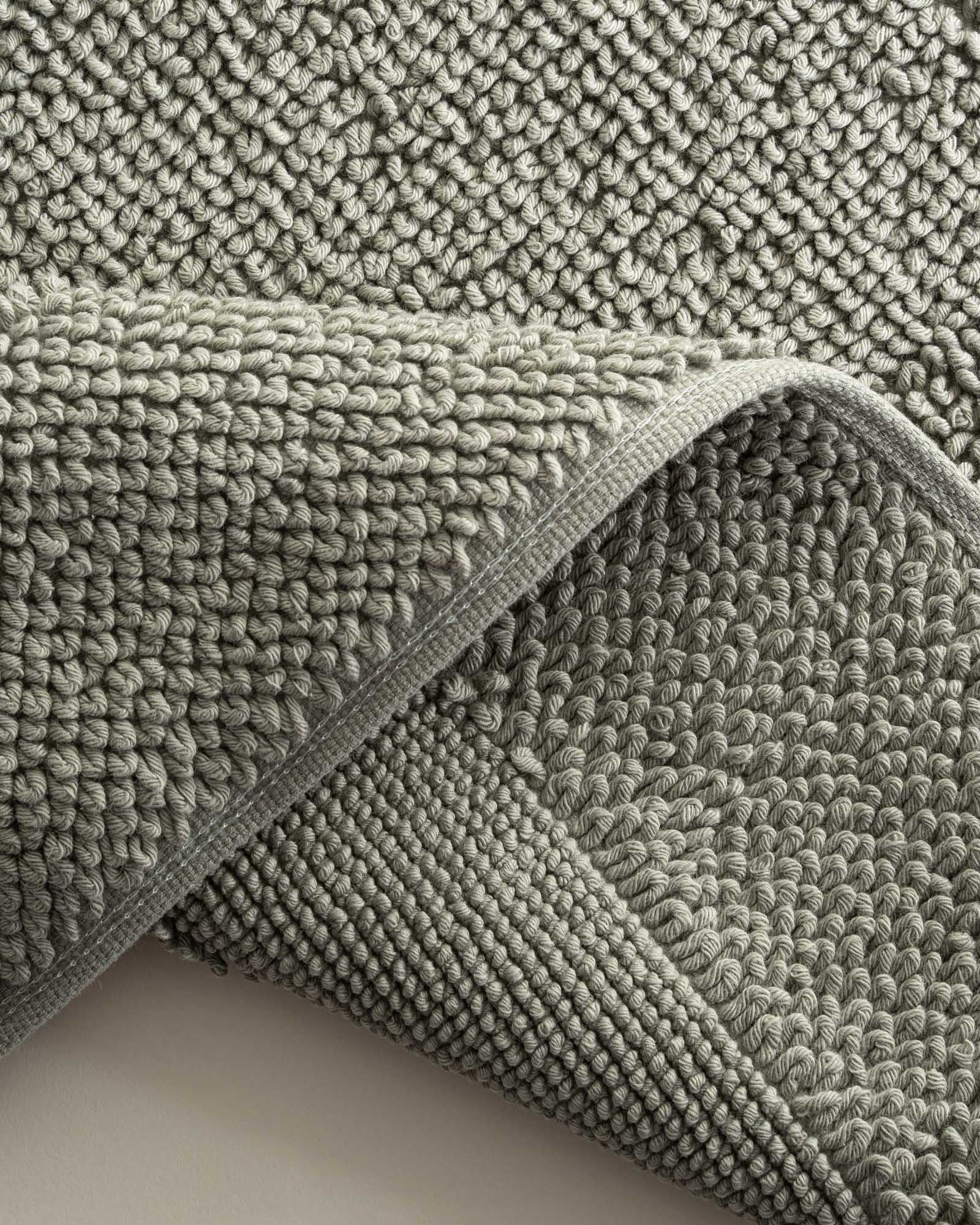 Close-up of the Kaia Aegean Cotton Bath Mat in Meadow Sage, showing its plush texture, natural tone, and high-quality finish