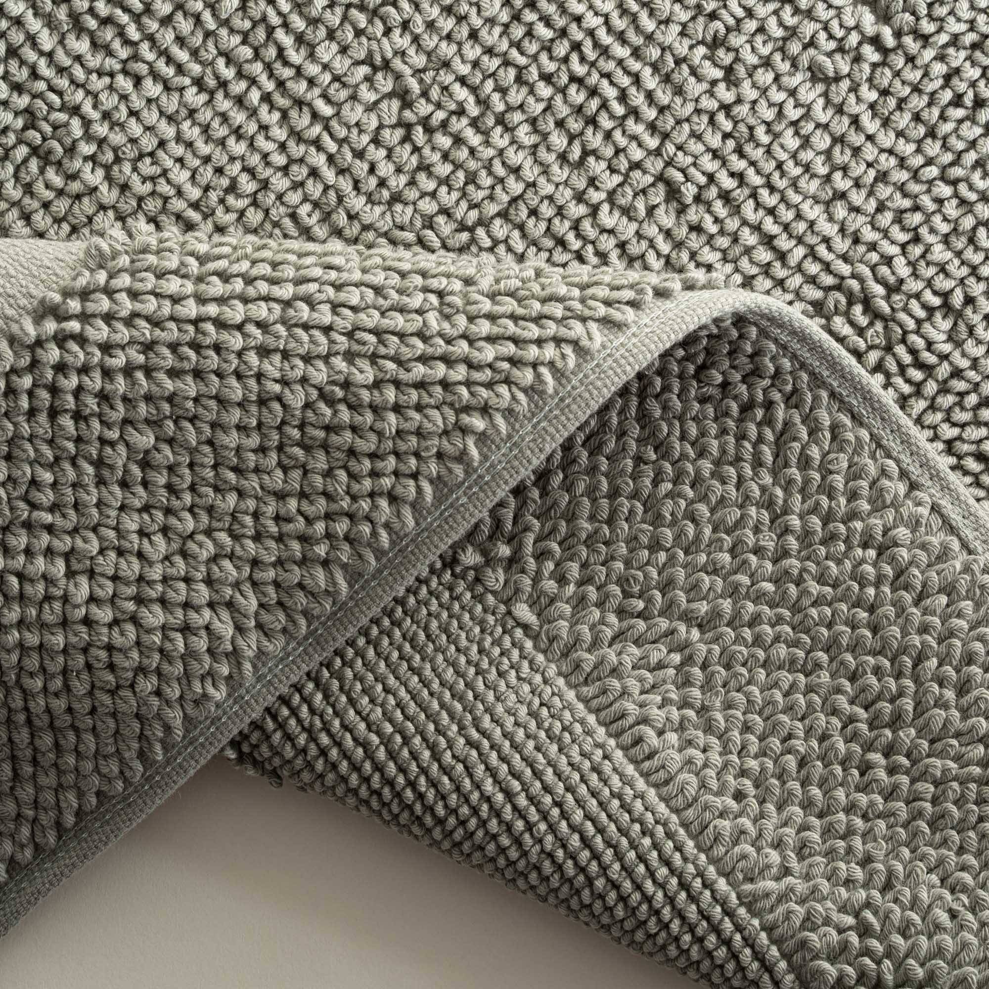 Close-up of the Kaia Aegean Cotton Bath Mat in Meadow Sage, showing its plush texture, natural tone, and high-quality finish
