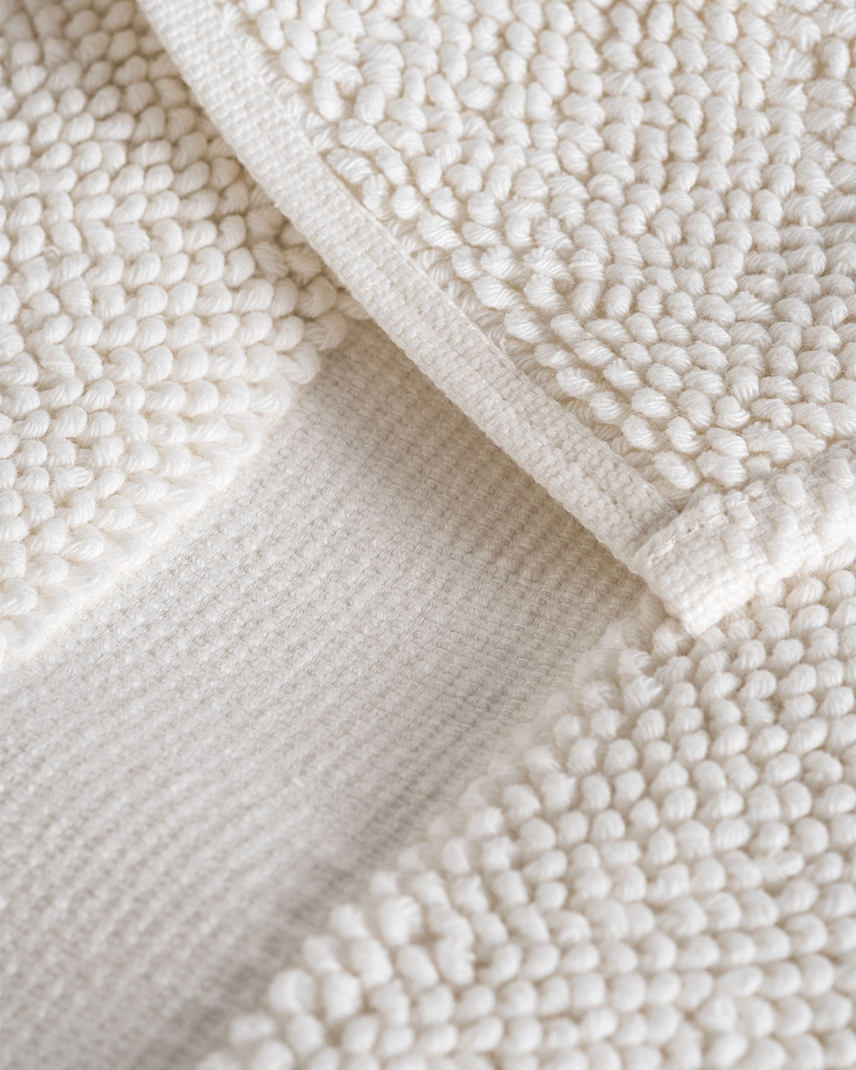 Close-up of the Kaia Aegean Cotton Bath Mat in Pearl Petal, showing its soft texture, elegant colour, and luxurious fabric