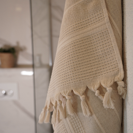 Minoa Arden Hemp and Organic Bath Towel hanging in a modern washroom, showcasing sustainable luxury and eco friendly design as a premium organic bath towel and luxury bath towel available in the USA and Canada