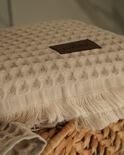 Close-up of Minoa USA Canada Seren organic cotton waffle luxury bath towels showing their plush texture, elegance, and sustainable luxury