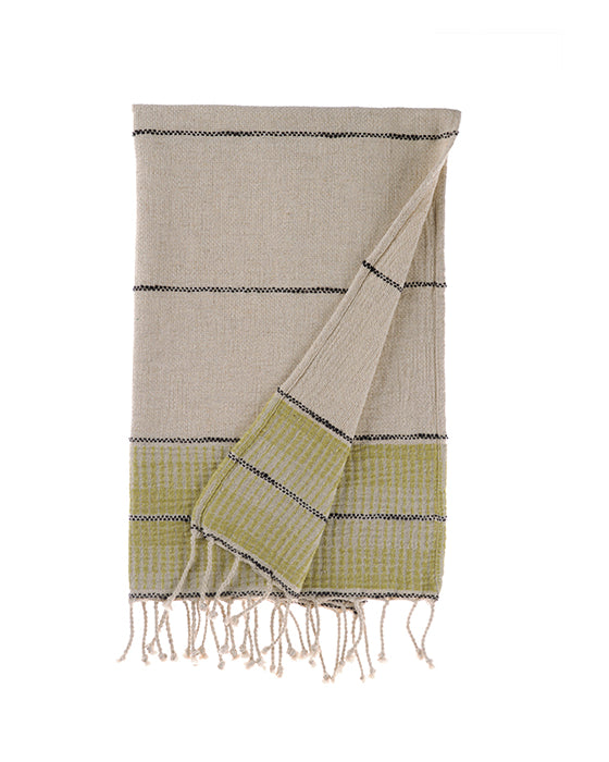 Towel with green and beige pattern on a white background