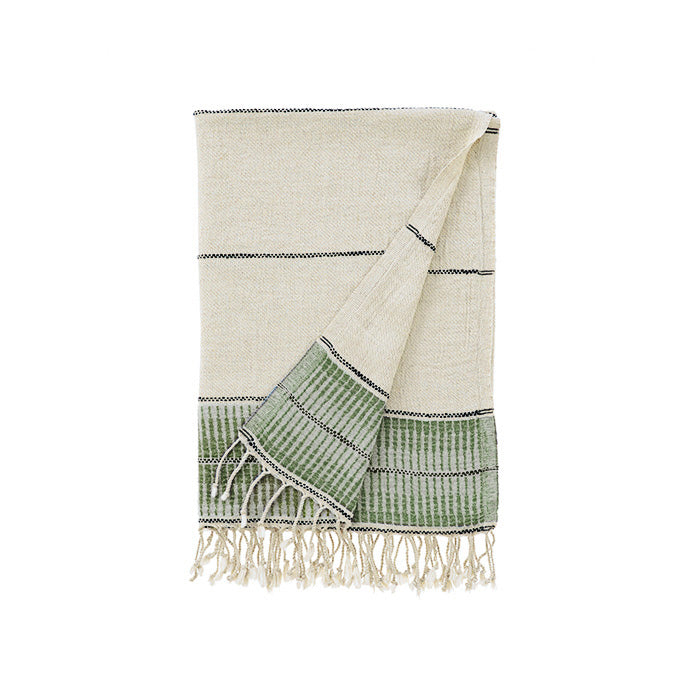 Beige and green towel with fringes on a white background