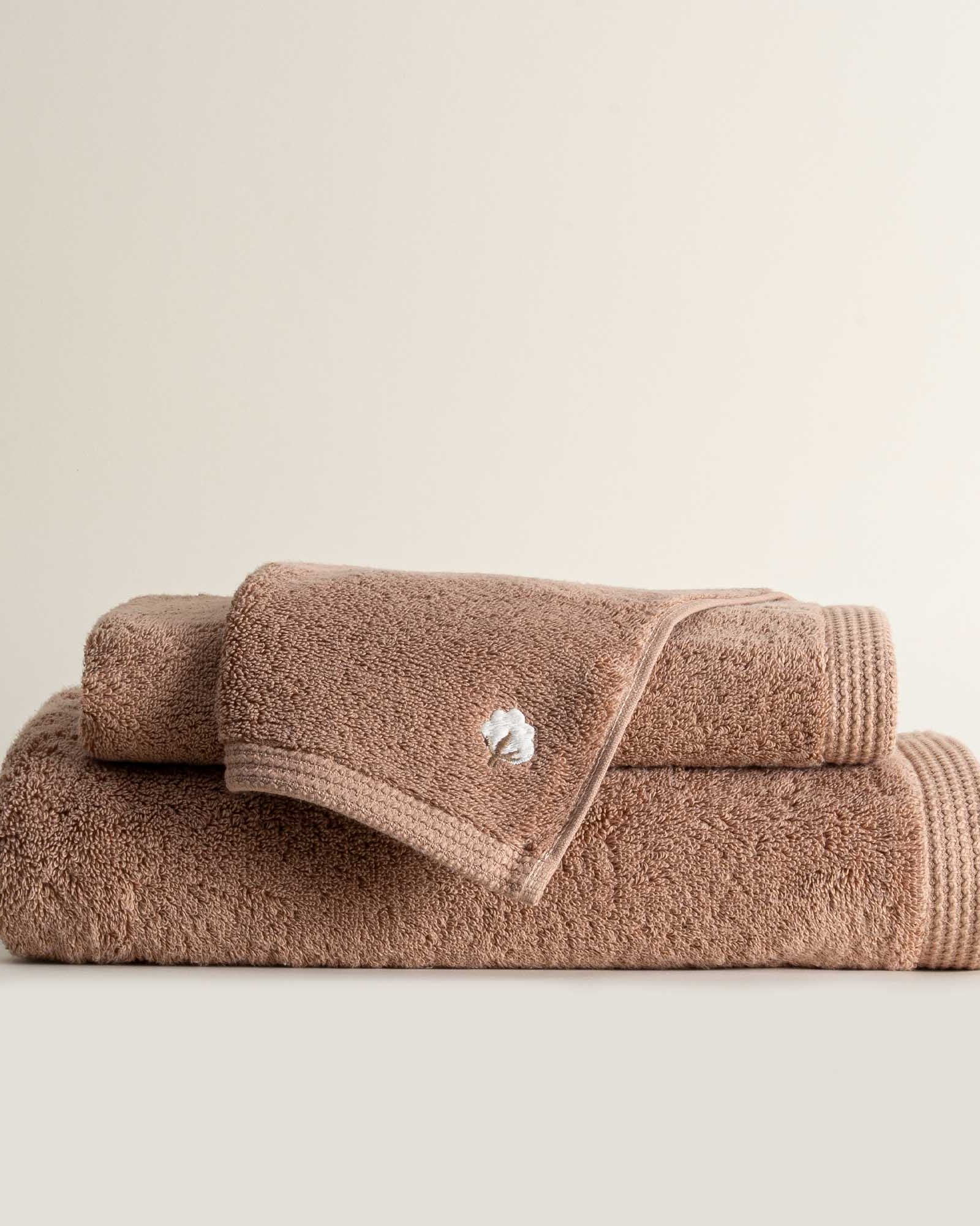 Jasper 600-gram organic Aegean cotton luxury bath, hand, and washcloth towels in Amber Amour, showcasing soft plush texture, rich tone, and luxurious fabric