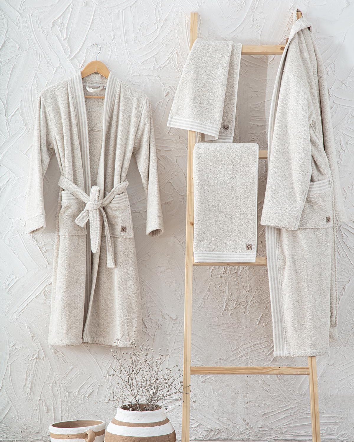 Minoa's organic, luxury bath robe -Raisa Hemp & Organic Cotton Mens Robe hanging on the wall