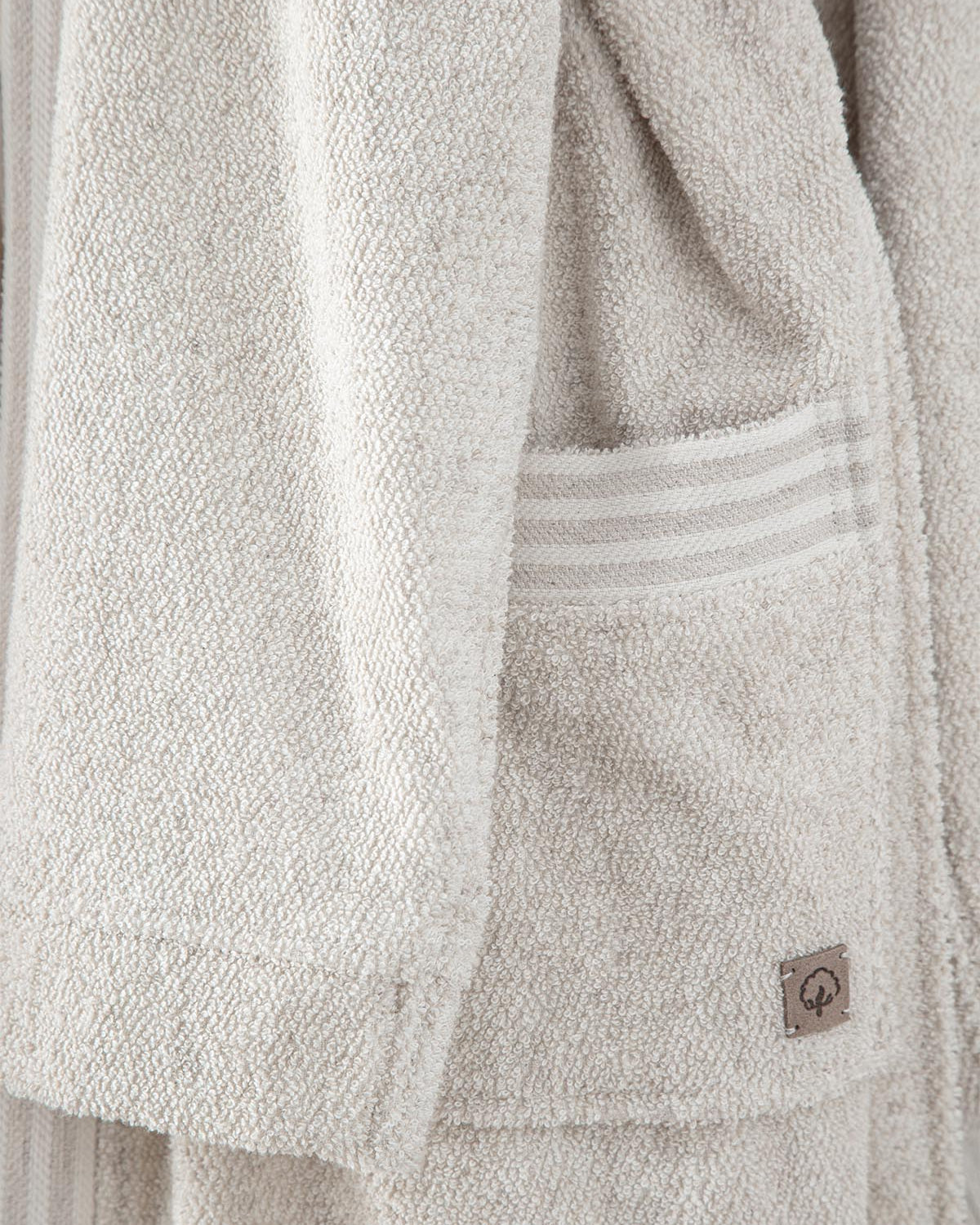 Minoa's eco-friendly, sustainable Raisa Hemp & Organic Cotton Mens Robe, a luxury bath robe featuring a side pocket, crafted from organic cotton and hemp for comfort and durability.