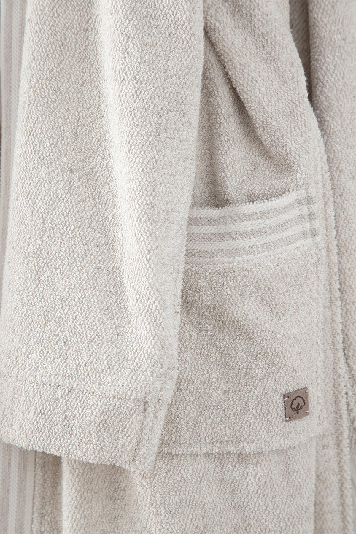 Minoa's eco-friendly, sustainable Raisa Hemp & Organic Cotton Mens Robe, a luxury bath robe featuring a side pocket, crafted from organic cotton and hemp for comfort and durability.