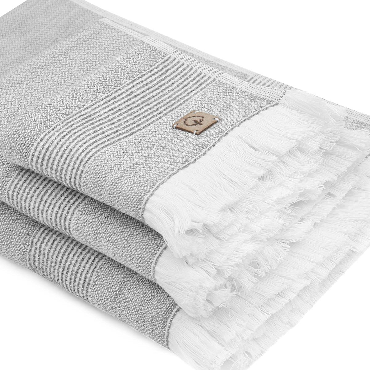 Gray and white towel with a brand logo on a white background