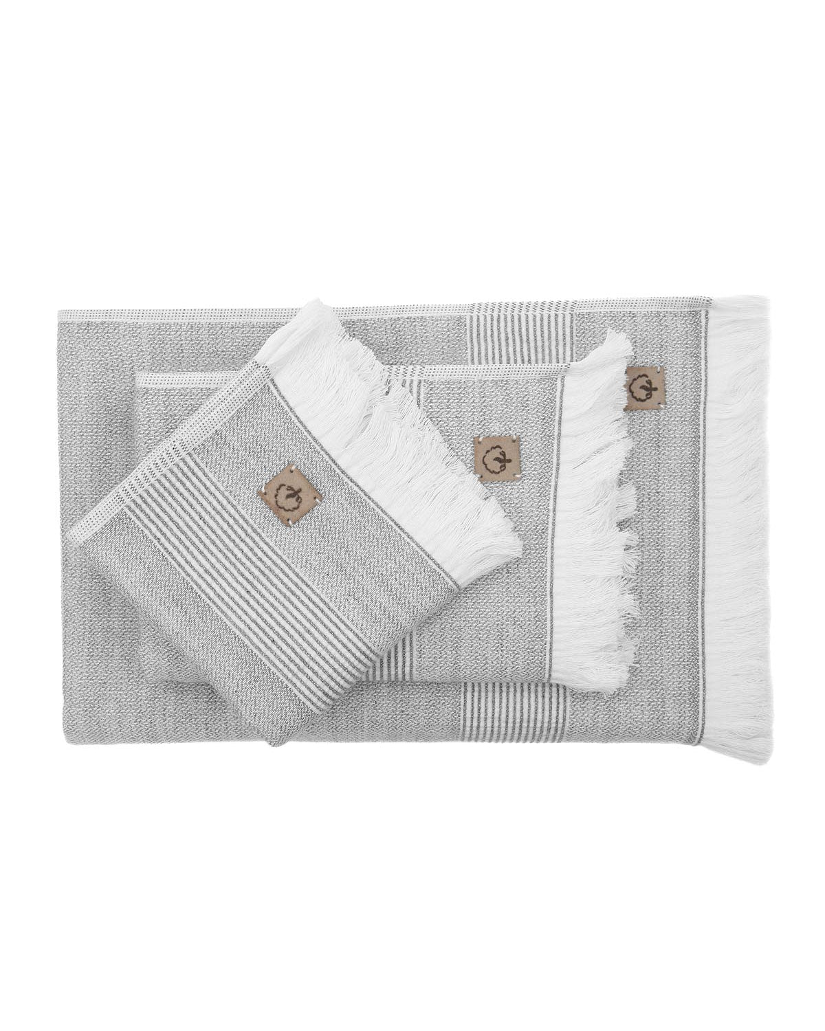 Top view of the three-piece Hasna Organic Aegean Cotton and Linen Bath Set in Grey Haze, showcasing the arrangement, texture, and soft neutral tone of the towels