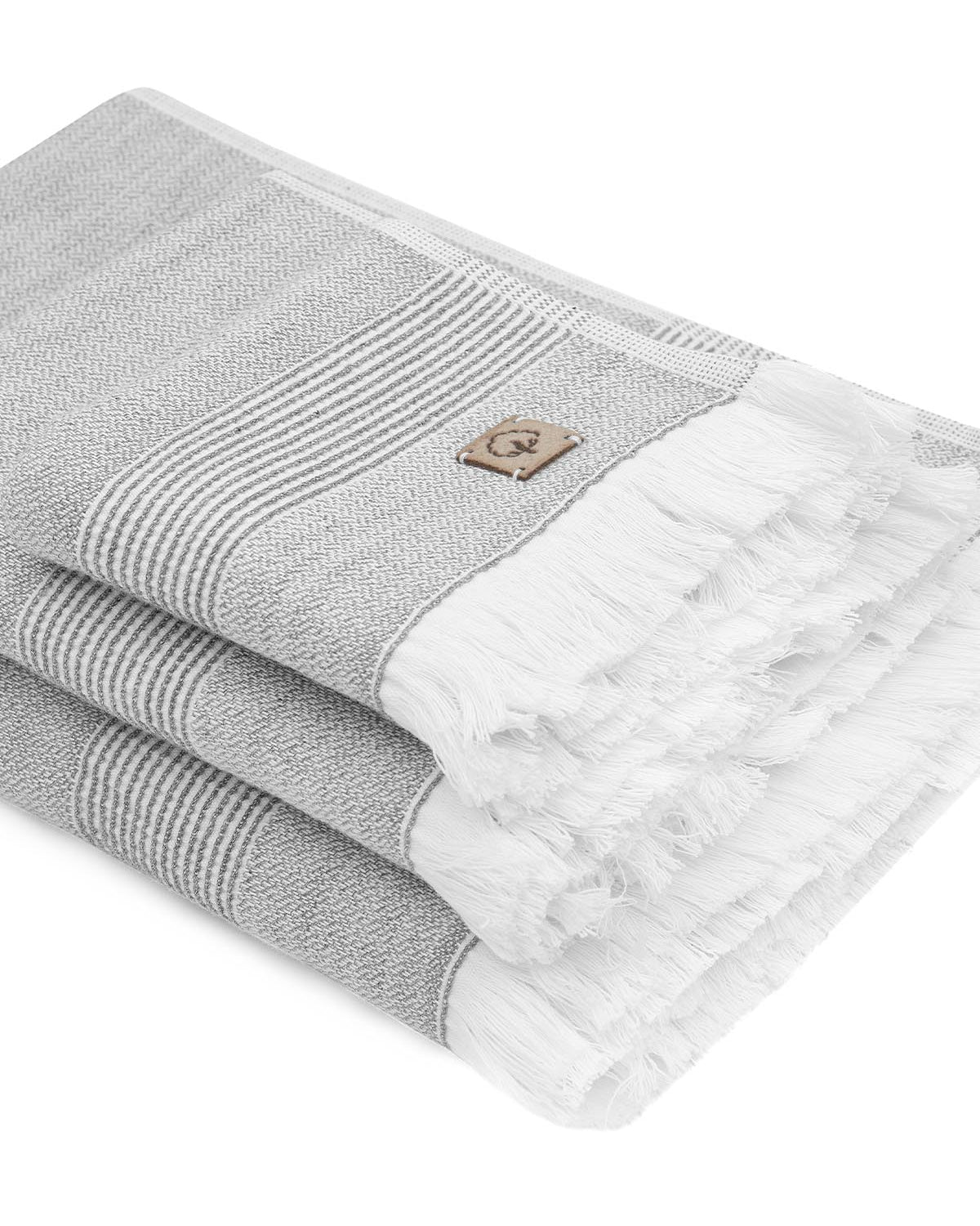 Side view of the three-piece Hasna Organic Aegean Cotton and Linen Bath Set in Grey Haze, highlighting the texture, softness, and layered thickness of each towel