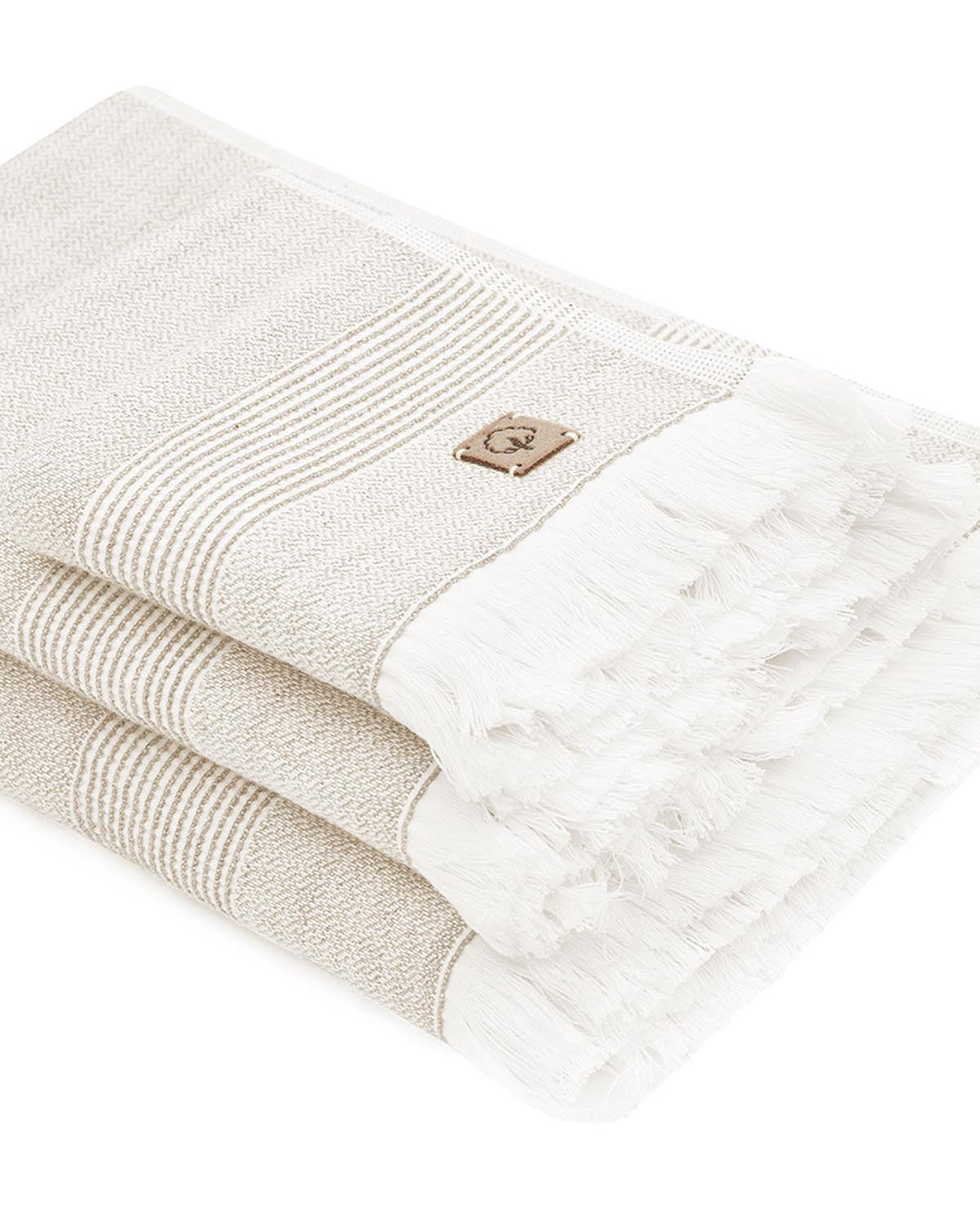 Close-up of the three-piece Hasna Organic Aegean Cotton and Linen Bath Set, showcasing the soft texture, natural tones, and fine craftsmanship of each towel
