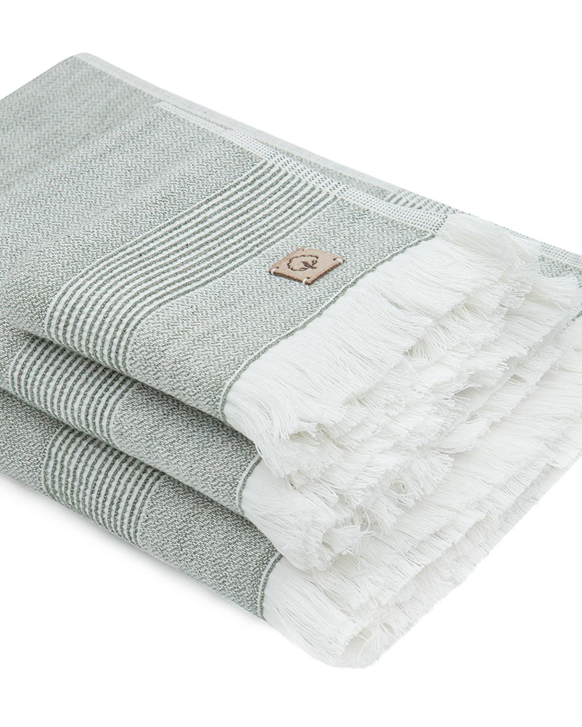 Side view of the three-piece Hasna Organic Aegean Cotton and Linen Bath Set in Pine Breeze, showing the layered thickness and texture of each towel
