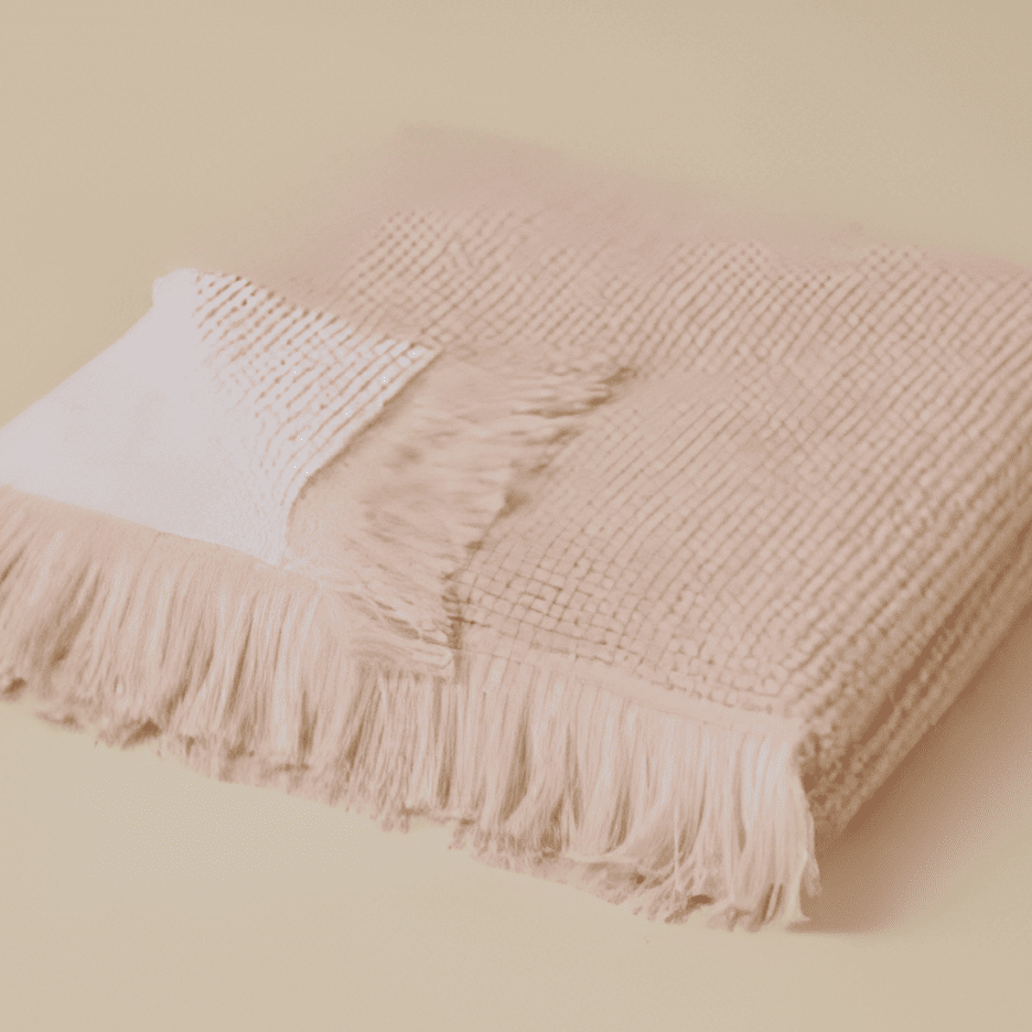 Plush 650-GSM Cotton Terry Towel in pink, an organic cotton towel featuring eyelash fringe, showcasing its soft texture and luxurious design.