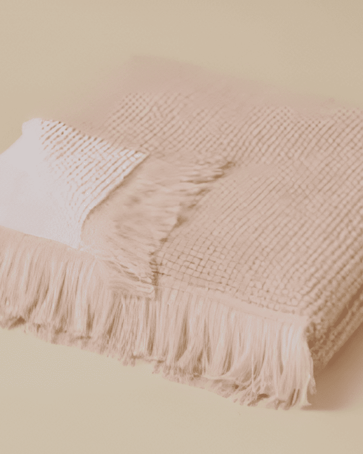 Plush 650-GSM Cotton Terry Towel in pink, an organic cotton towel featuring eyelash fringe, showcasing its soft texture and luxurious design.