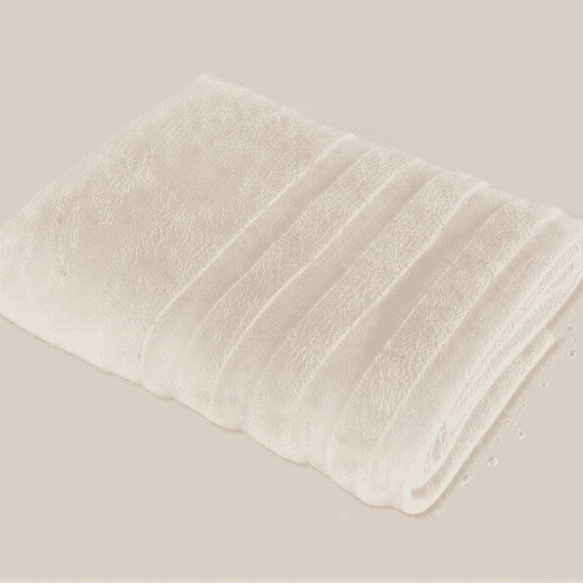 Velora 550-GSM Cotton Towel in beige, an organic cotton towel offering a soft, plush feel with excellent absorbency, perfect for everyday use.