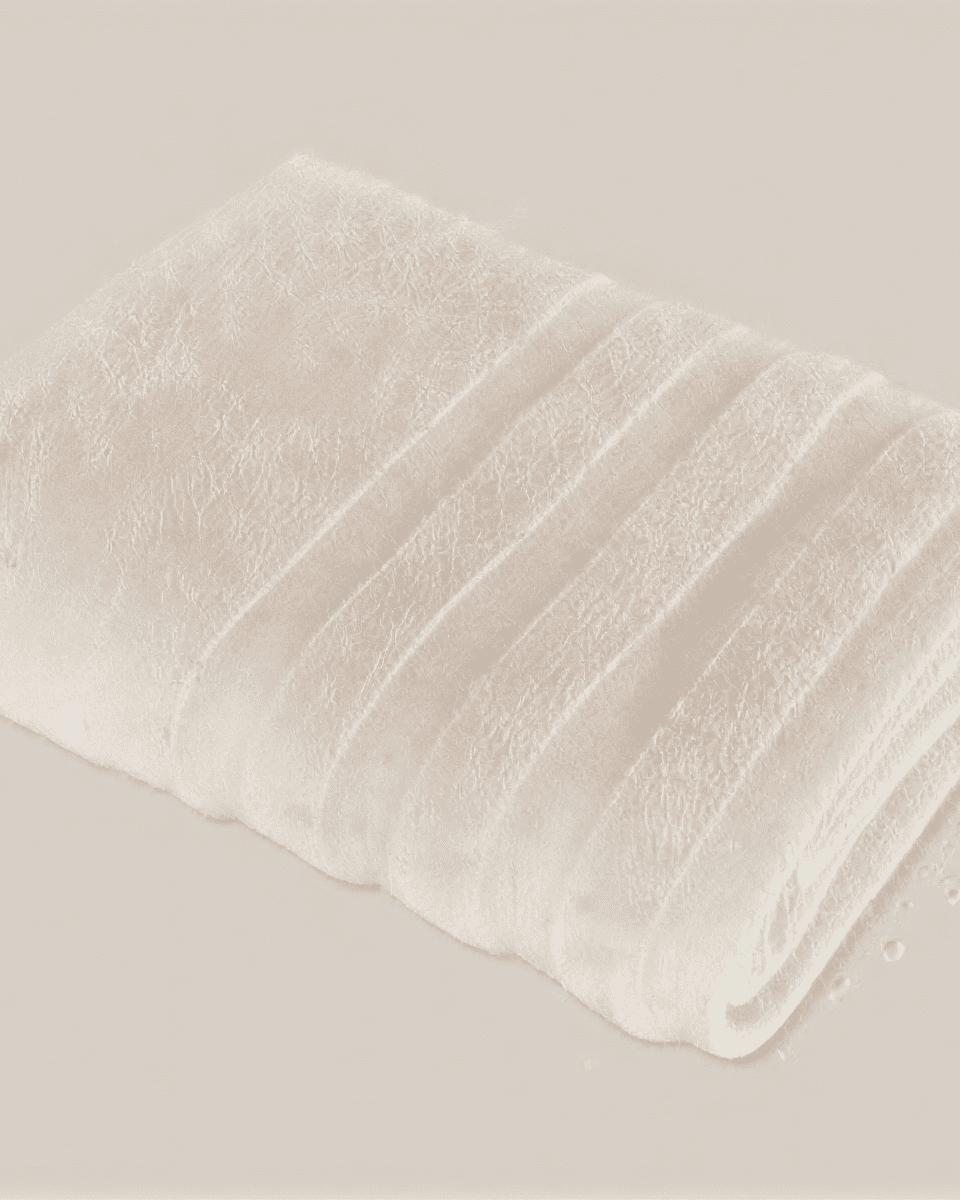 Velora 550-GSM Cotton Towel in beige, an organic cotton towel offering a soft, plush feel with excellent absorbency, perfect for everyday use.