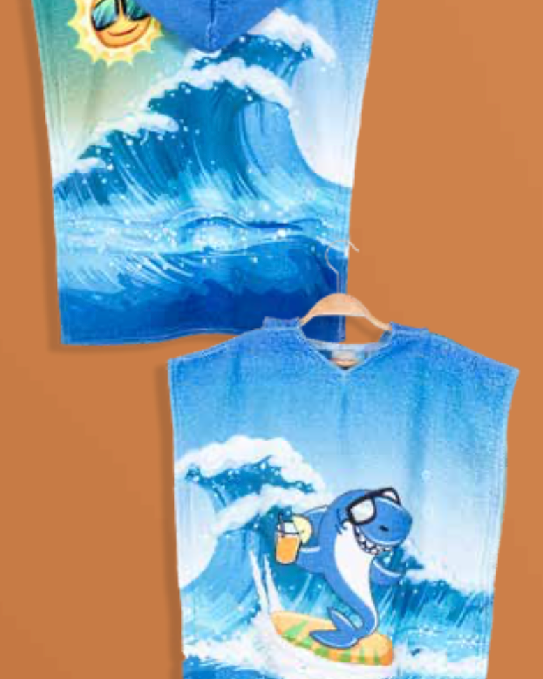 Children's poncho with a fun shark pattern, designed with soft cotton for a cozy, adventurous feel after bath time or swimming