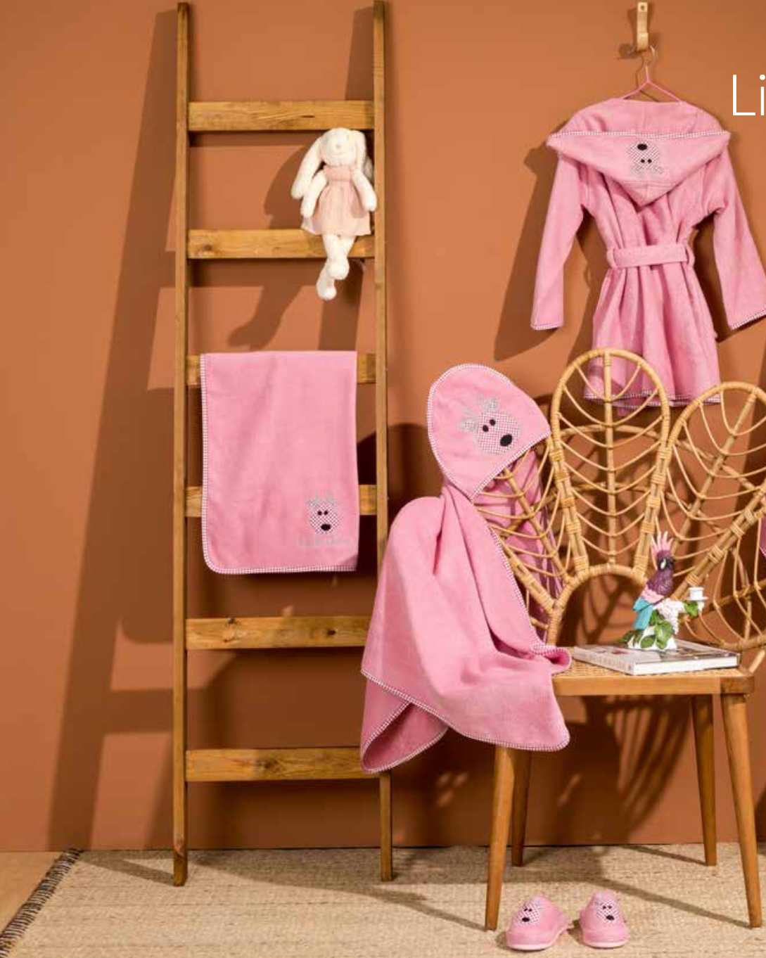 Children's bath set in pink featuring a cute little deer pattern on the towel, bathrobe, and slippers, providing a soft and cozy design for kids
