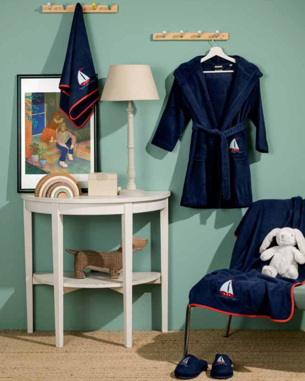 Children's bath set featuring a sailing theme on towel, bathrobe, and slippers, with ships and nautical elements for an adventurous design