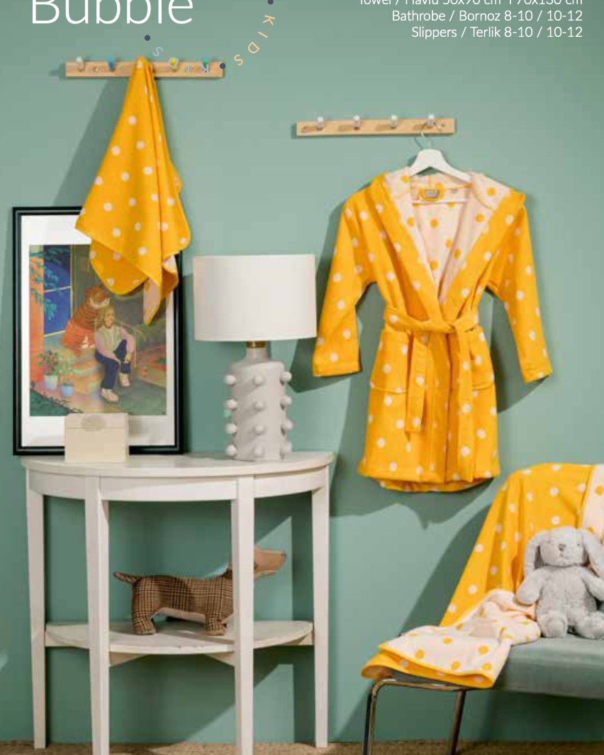 Children's bath set with an orange bubble pattern on towel, bathrobe, and slippers, offering a playful and colourful design