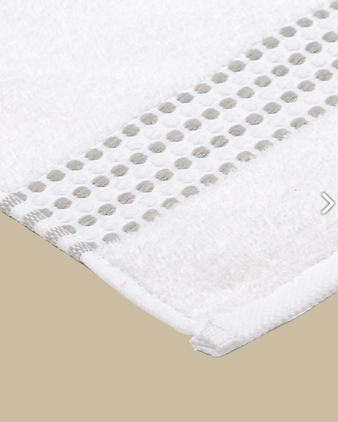 Close-up classy 460-GSM Cotton/Viscose Towel in white, an organic cotton towel offering a soft, luxurious feel with excellent absorbency and a crisp, fresh look