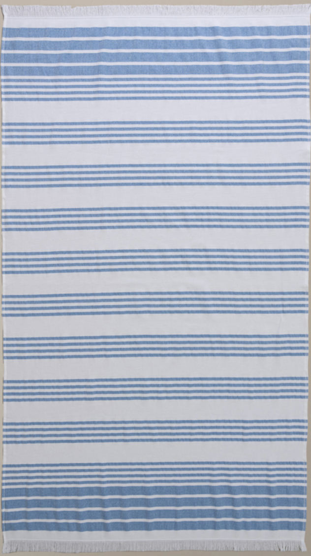 Navy/White Nesta beach towel made with 100% organic cotton, with a luxuriously soft texture and carefully fabricated comfort