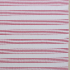 Fuchsia/White Nesta beach towel made with 100% organic cotton, with a luxuriously soft texture and carefully fabricated comfort