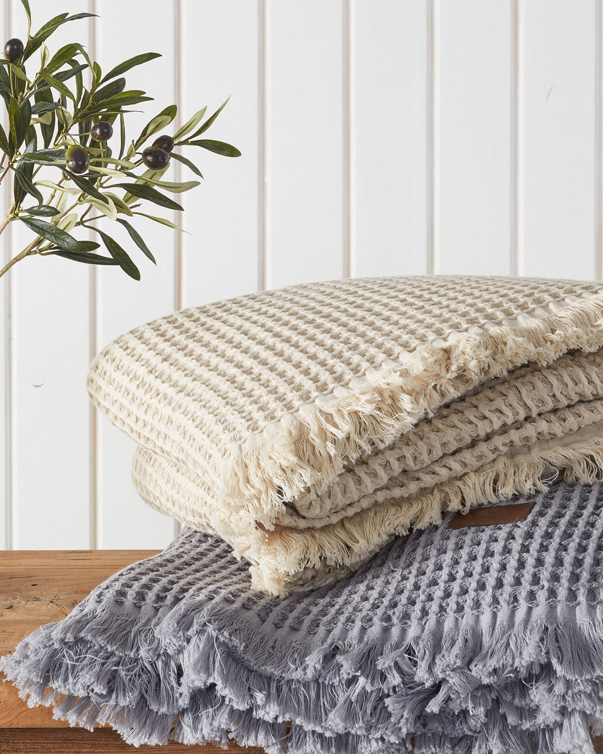 Two Organic Aegean Seren Waffle Large Throw/Bed Spreads 400-gram in Silver Suede and Beige, highlighting their luxurious texture and eco-friendly organic cotton design