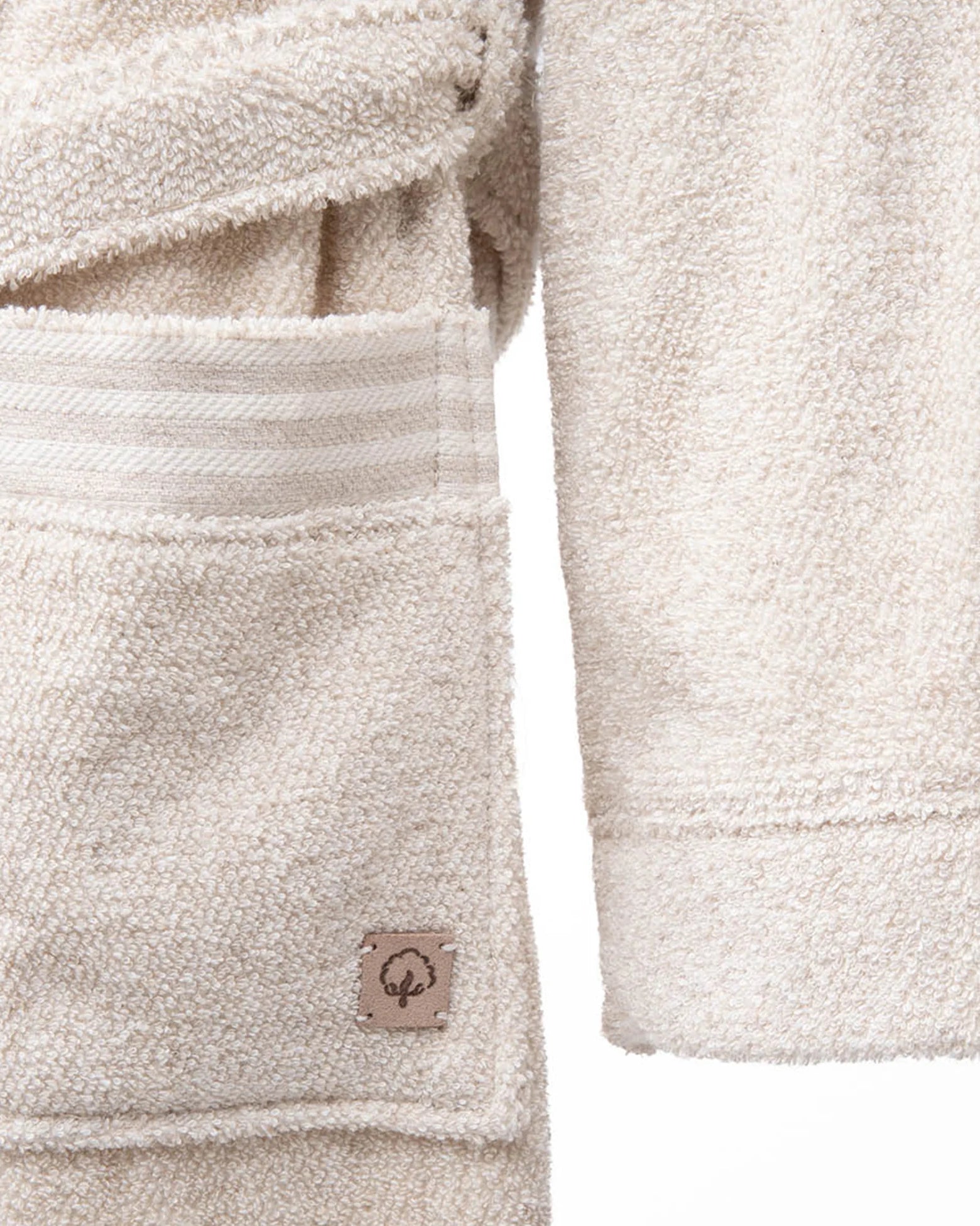 Minoa's Raisa Hemp & Organic Cotton Mens Robe, a sustainable luxury bath robe with a delicately designed long sleeve, offering exceptional comfort and timeless style.