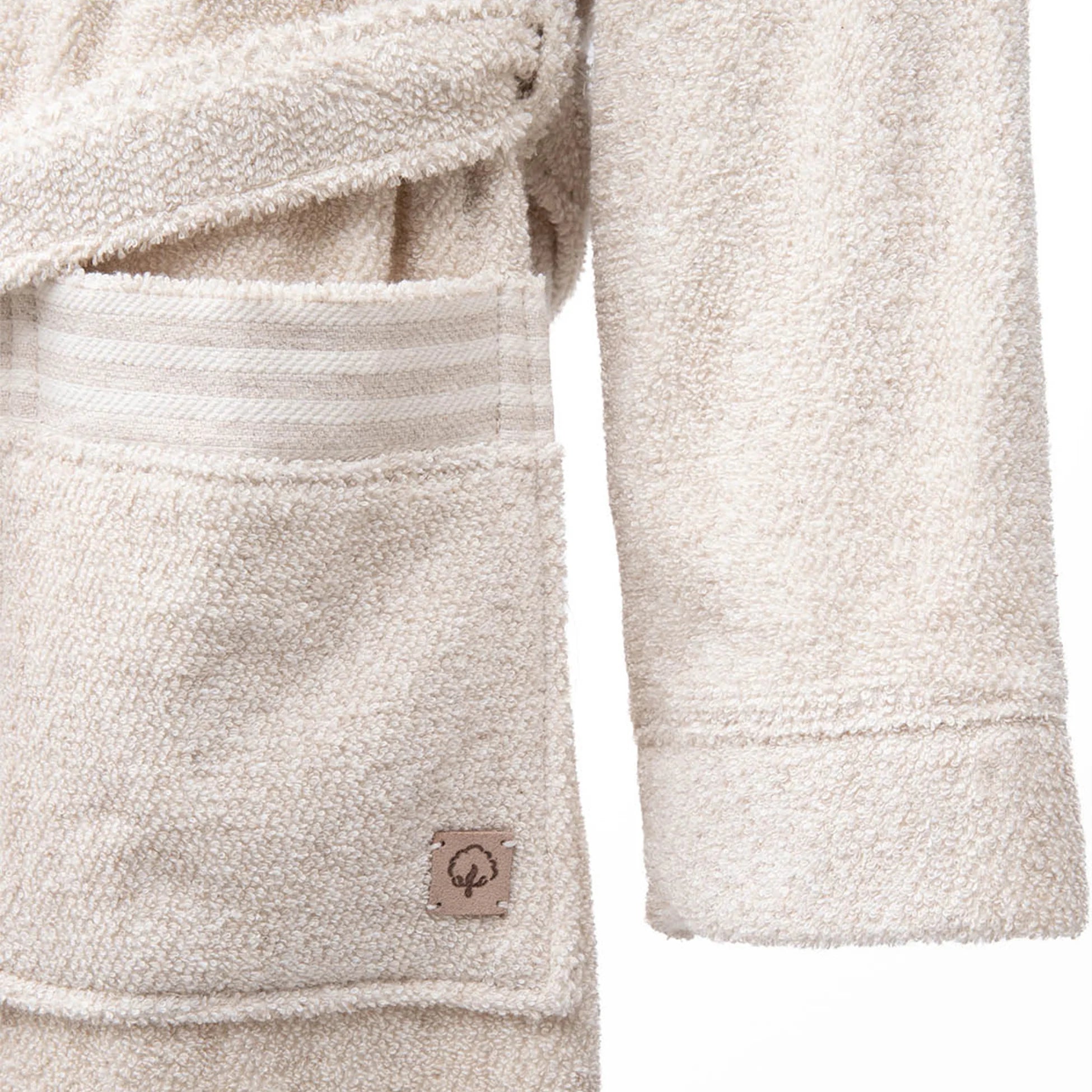 Minoa's Raisa Hemp & Organic Cotton Mens Robe, a sustainable luxury bath robe with a delicately designed long sleeve, offering exceptional comfort and timeless style.