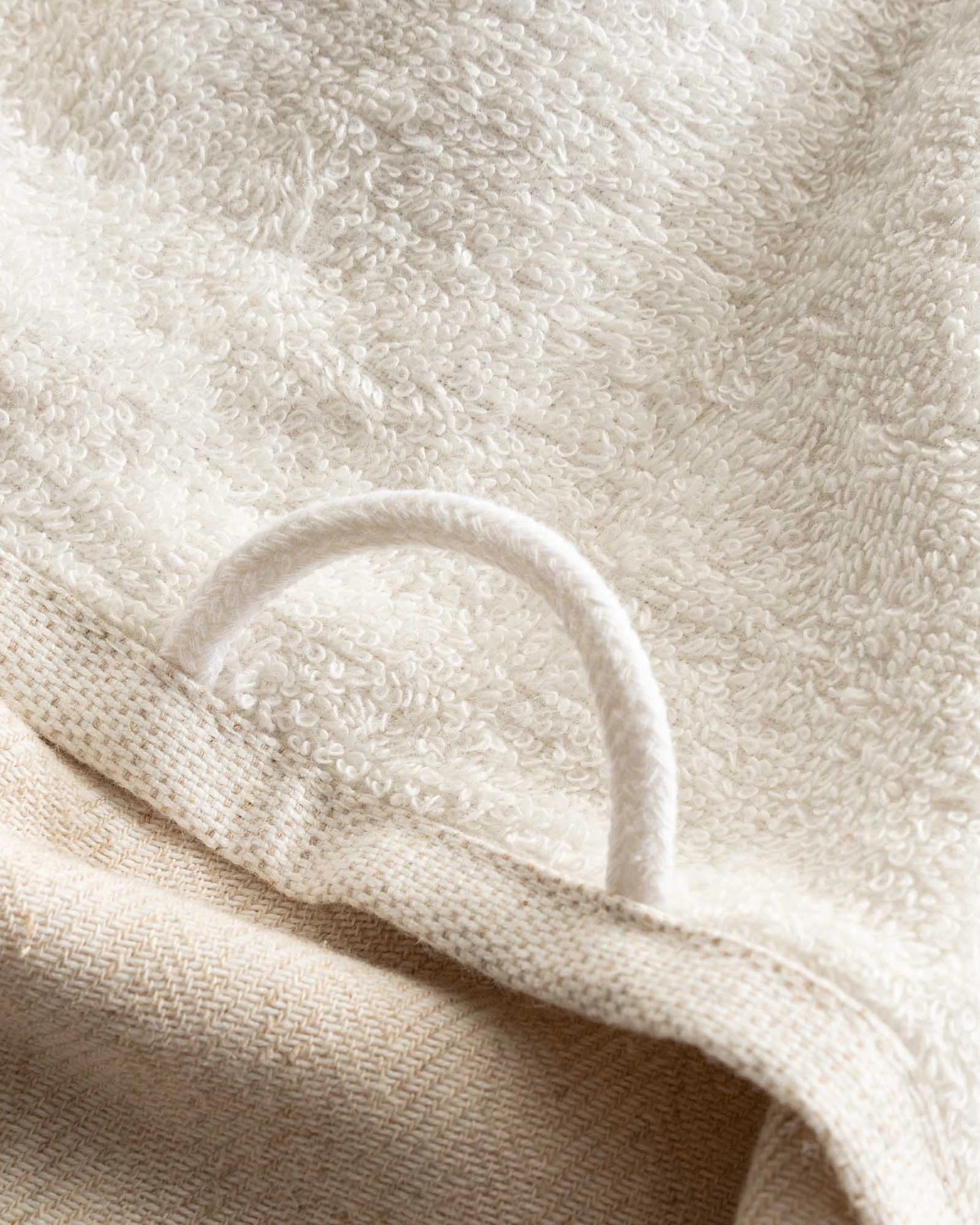 The towel hanger of Minoa's luxurious, eco-friendly three-pieces Erva Organic Aegean Cotton Bath Set