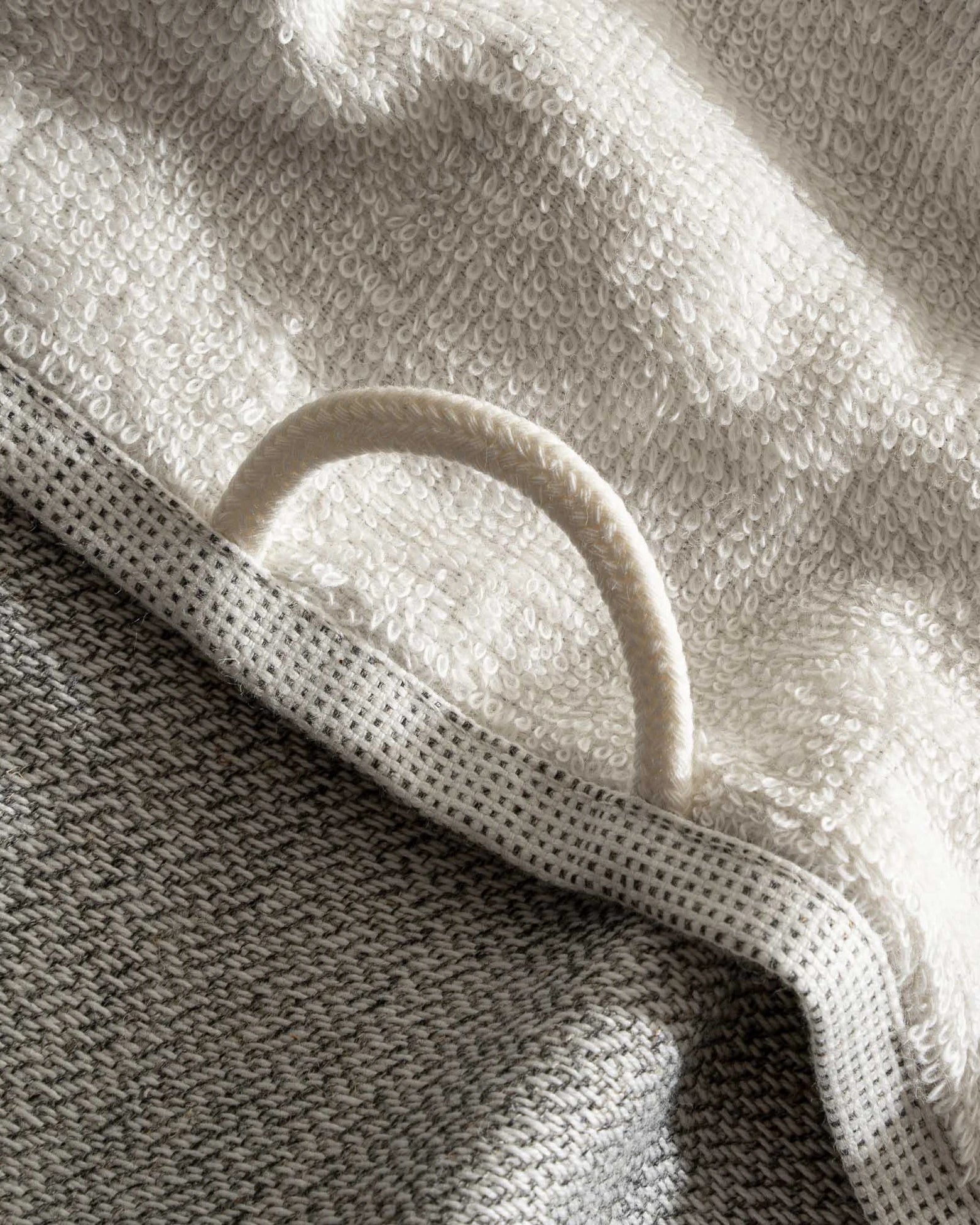 The towel hanger of Minoa's luxurious, eco-friendly three-pieces Hasna Organic Aegean Cotton and Linen Bath Set in Grey Haze