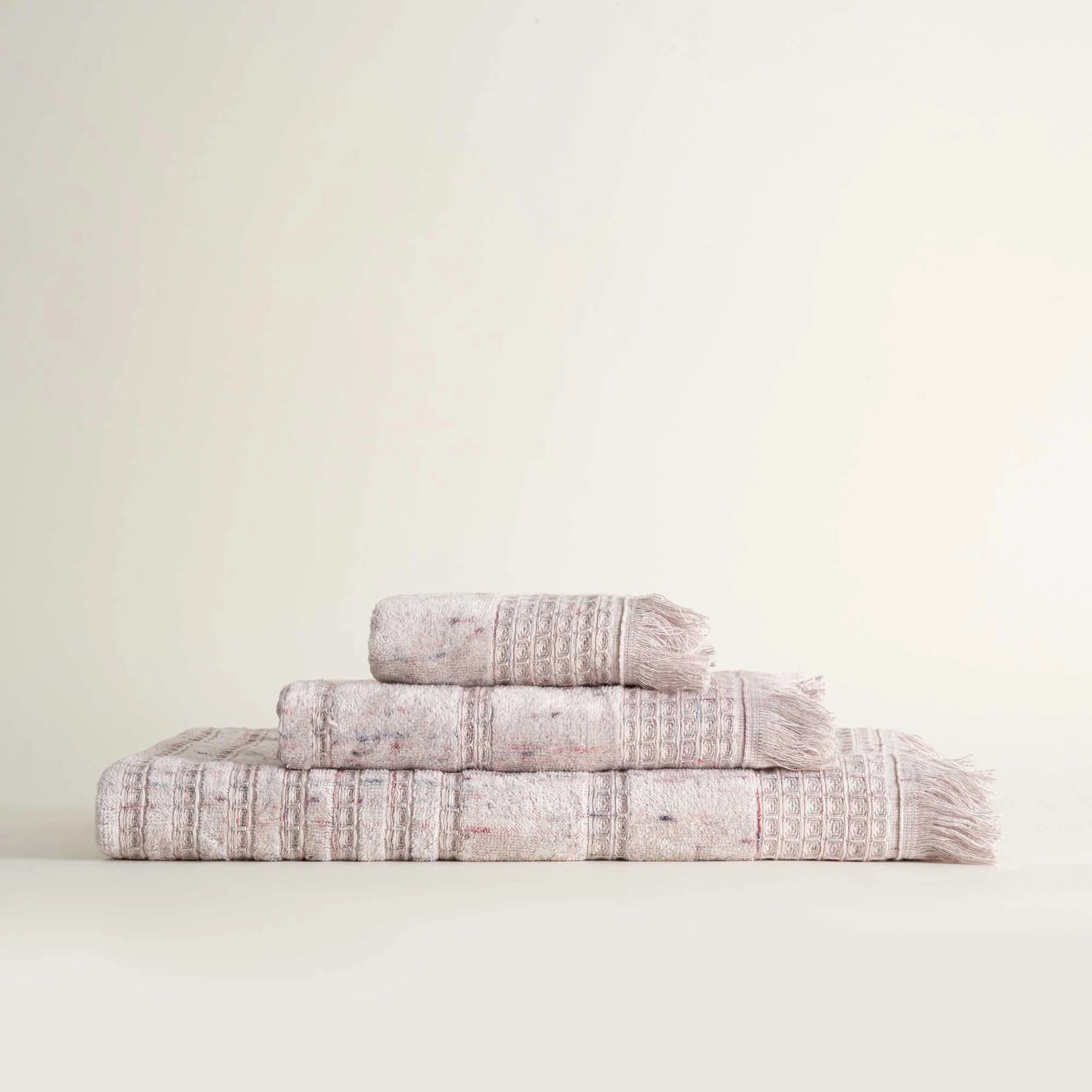 Front view of Maia organic cotton bath hand and washcloth set in Pink Powder neatly arranged to highlight its soft texture and eco friendly design of organic bath towels